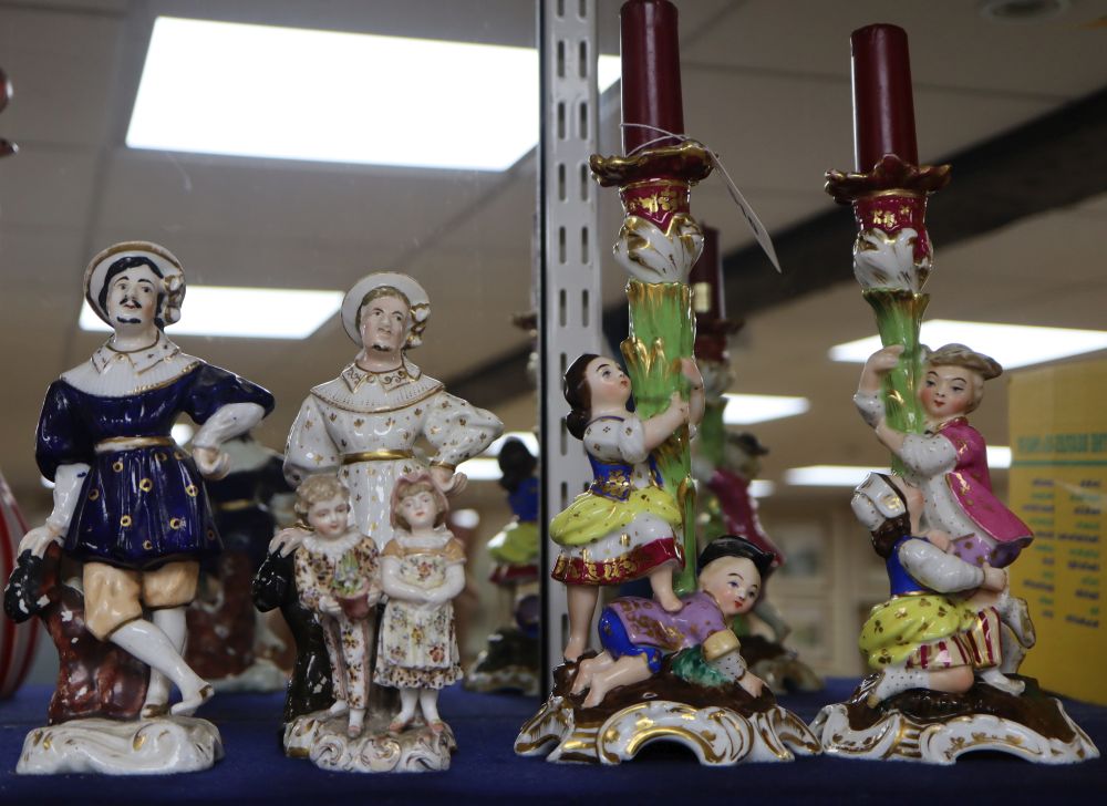 A pair of porcelain candlesticks, a pair of German porcelain figures and a later 19th century Continental figure